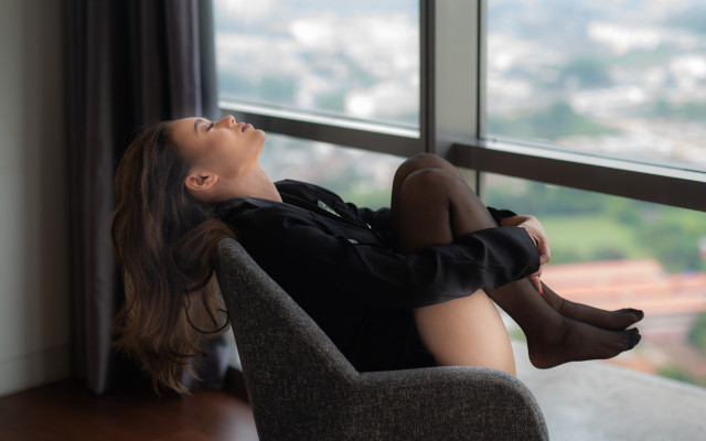 Woman sitting window city portrait free wallpaper for desktop - medium preview image