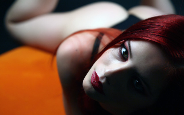 Red hair woman bed blurry free wallpaper for desktop - medium preview image