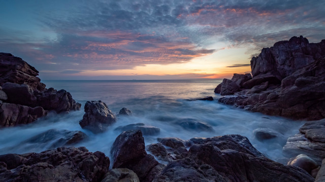 Rocky beach sunset cave city free wallpaper for desktop - medium preview image