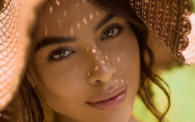 Sunlit portrait hat shadow green free wallpaper for desktop - medium preview image