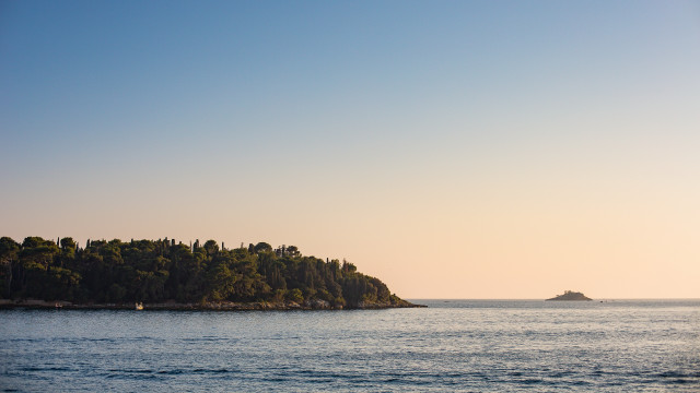 Small island ocean boat mountain #2 free wallpaper for desktop - medium preview image