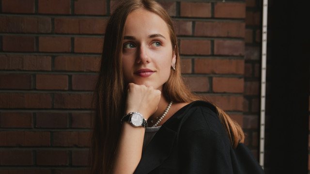 Elina Karimova BlackDress LongHair BrickWall free wallpaper for desktop - medium preview image