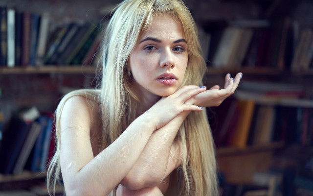 Blonde woman library portrait bokeh free wallpaper for desktop - medium preview image