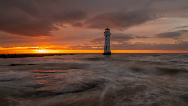 Lighthouse ocean sunset cloudy sky free wallpaper for desktop - medium preview image