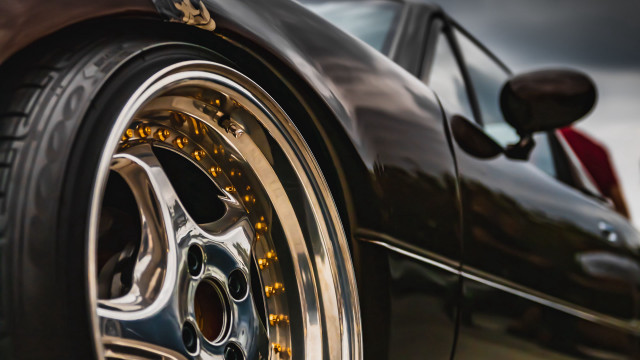 Car tire closeup cloudy sky free wallpaper for desktop - medium preview image