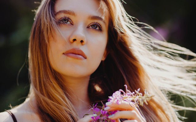 Woman holding dandelion smiling portrait free wallpaper for desktop - medium preview image