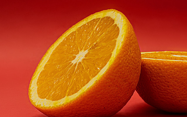 Orange halved both on red free wallpaper for desktop - medium preview image