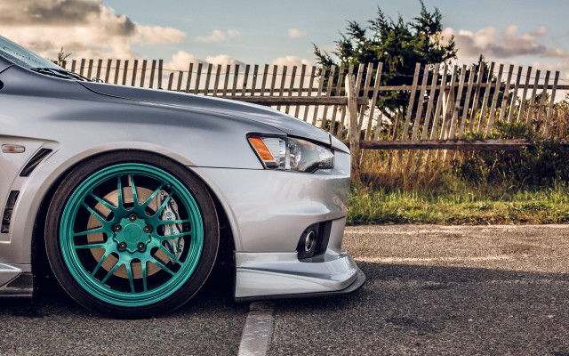 Silver car green rim parking free wallpaper for desktop - medium preview image