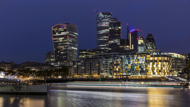 City skyline night boat reflection free wallpaper for desktop - medium preview image