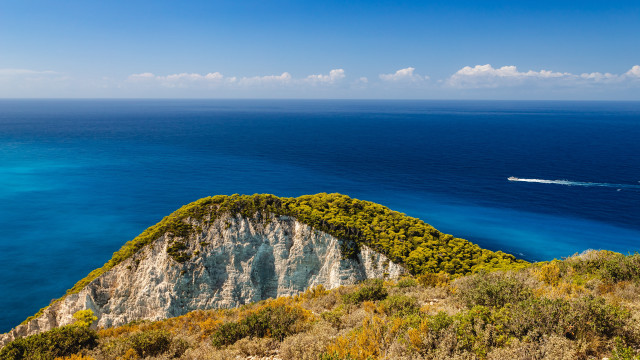 Boat cliff beach landscape sunset free wallpaper for desktop - medium preview image
