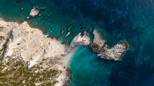 Aerial rocky beach clear water free wallpaper for desktop - medium preview image