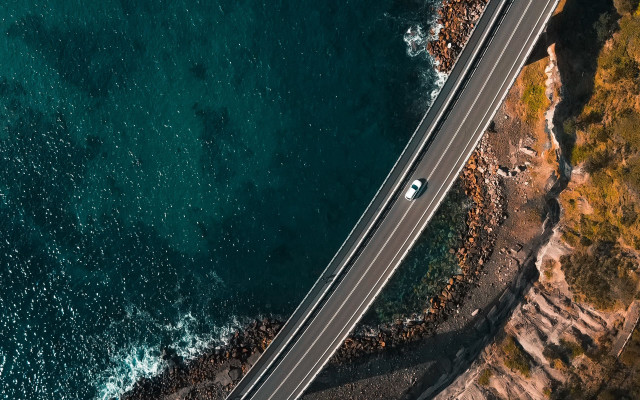 Ocean cliff road car cinematic free wallpaper for desktop - medium preview image