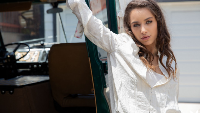 Woman green truck leaning white free wallpaper for desktop - medium preview image