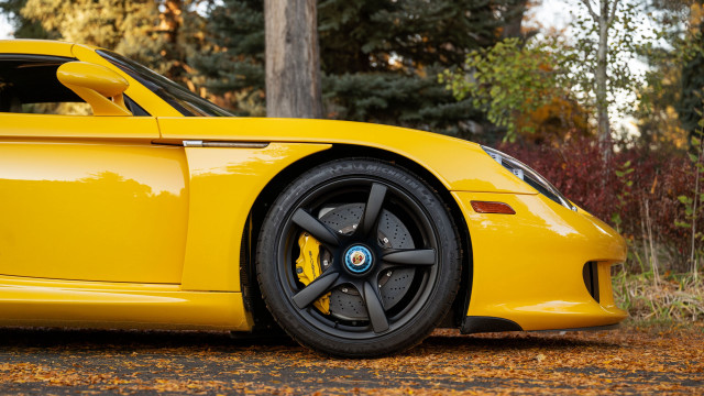 Yellow sports car wooded area free wallpaper for desktop - medium preview image
