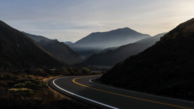 Mountain road sunset clouds forest free wallpaper for desktop - medium preview image