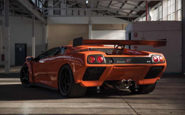 Orange sports car garage red free wallpaper for desktop - medium preview image