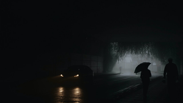 Person walking umbrella dark street free wallpaper for desktop - medium preview image