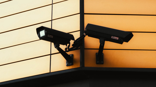 Cameras building wall yellow black free wallpaper for desktop - medium preview image