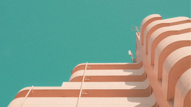 Bird perched building blue sky free wallpaper for desktop - medium preview image