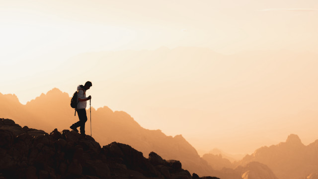Mountain hiker sunset sky clouds free wallpaper for desktop - medium preview image