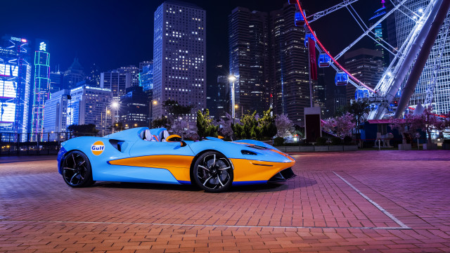 Blue yellow sportscar parkinglot city free wallpaper for desktop - medium preview image