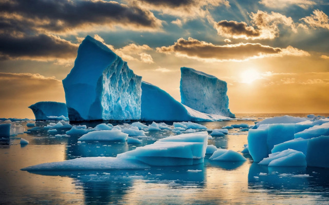 Icebergs ocean sunset cloudy sky free wallpaper for desktop - medium preview image