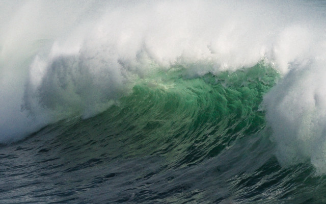 Large wave crashing over surfer free wallpaper for desktop - medium preview image