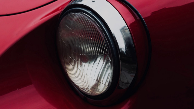 Red car headlight ultrafine photorealism free wallpaper for desktop - medium preview image