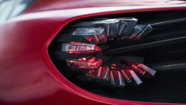 Red sports car side mirror free wallpaper for desktop - medium preview image