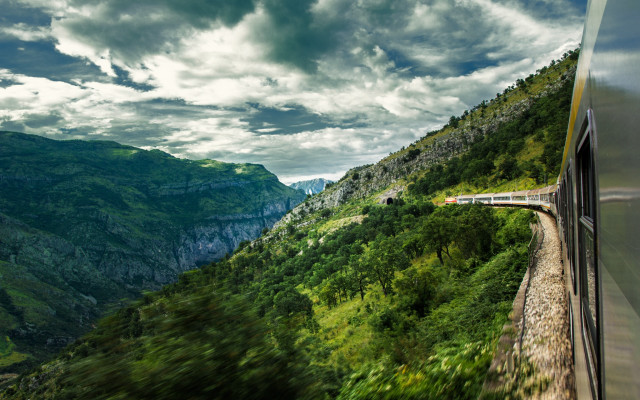 Lush green mountain train cloudy free wallpaper for desktop - medium preview image