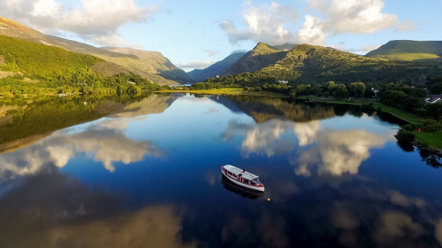 Boat lake mountains clouds reflection free wallpaper for desktop - medium preview image