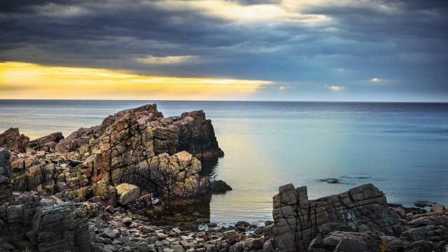 Rocky outcropping ocean clouds sunbeam free wallpaper for desktop - medium preview image