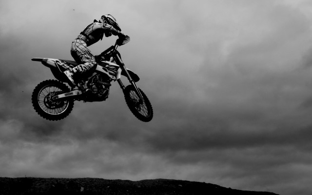 Man dirtbike air over hill free wallpaper for desktop - medium preview image