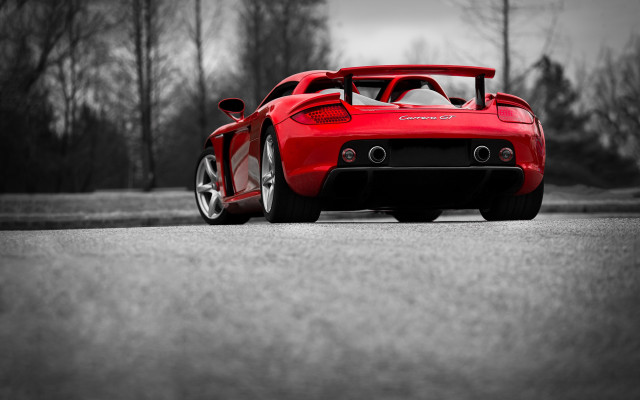 Red sports car tiltshift cherryblossoms free wallpaper for desktop - medium preview image