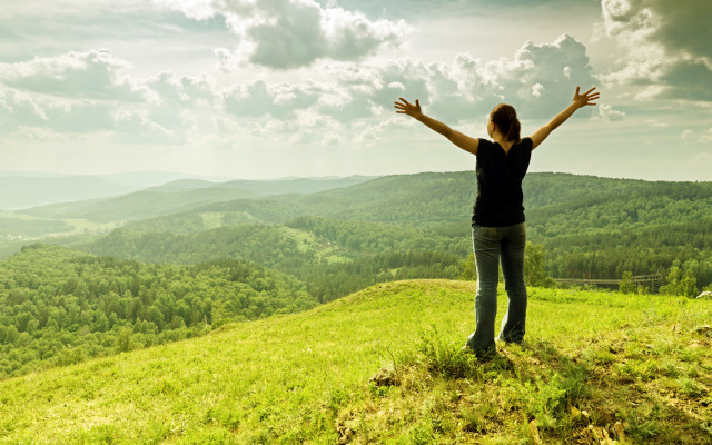 Woman hands outstretched hill mountains free wallpaper for desktop - medium preview image