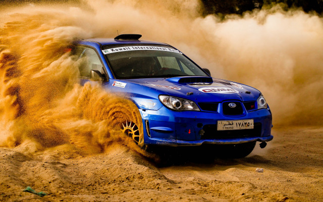 Blue car dusty desert action free wallpaper for desktop - medium preview image