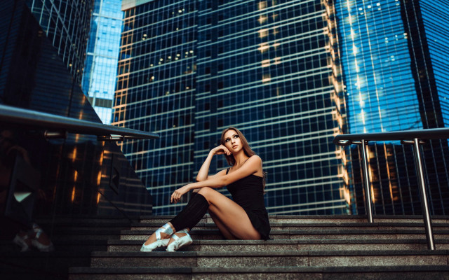 Woman sitting stairs cityscape architecture free wallpaper for desktop - medium preview image