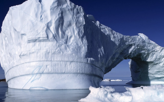 Large iceberg ocean shoreline boat free wallpaper for desktop - medium preview image