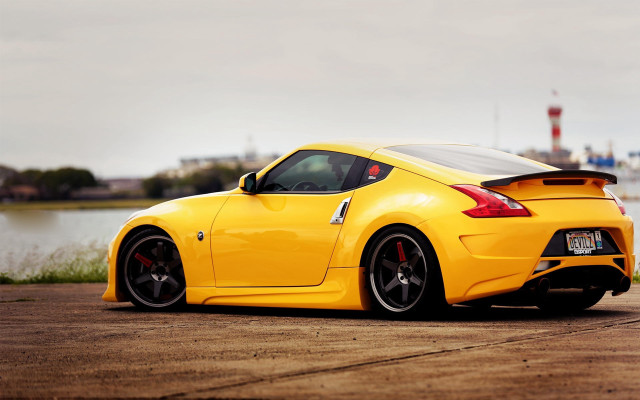 Yellow sports car water city free wallpaper for desktop - medium preview image