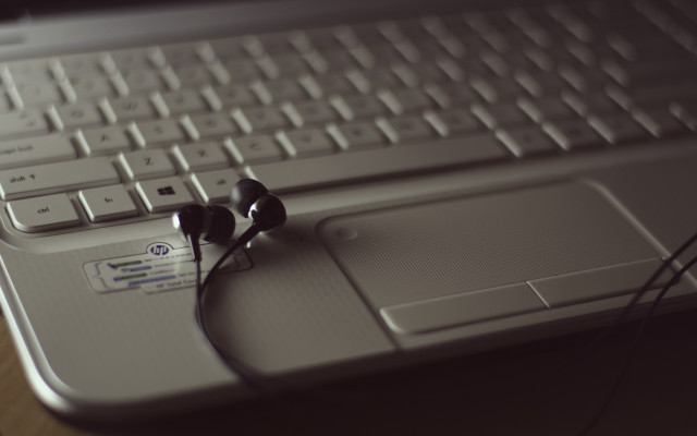Headphones laptop mouse desk tiltshift free wallpaper for desktop - medium preview image