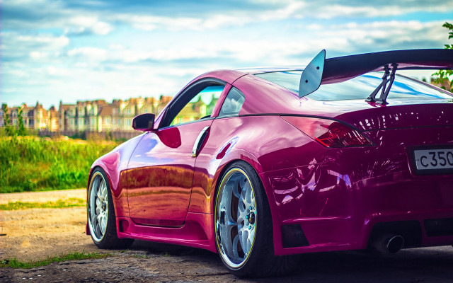 Pink sports car dirt road free wallpaper for desktop - medium preview image