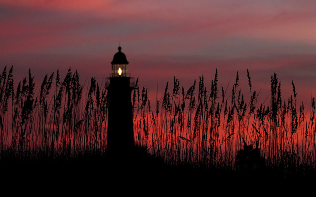 Lighthouse silhouette redsky tallgrass sunset free wallpaper for desktop - medium preview image