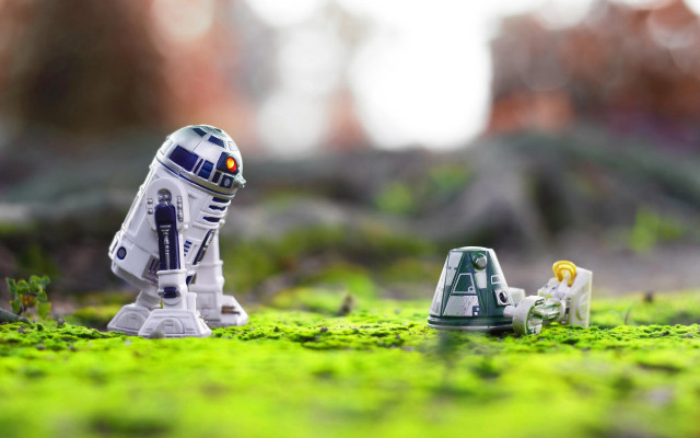 Toy robot grass building blurry free wallpaper for desktop - medium preview image