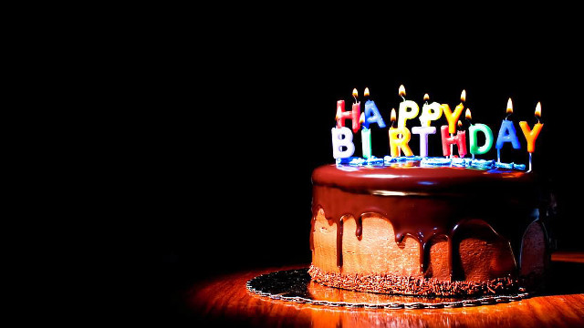 Chocolate birthday cake lit candles #3 free wallpaper for desktop - medium preview image