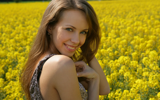 Woman field yellowflowers smiling autumn free wallpaper for desktop - medium preview image