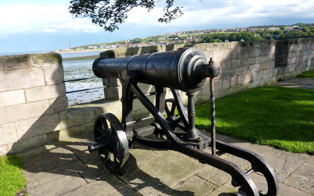 Cannon stone wall water grass free wallpaper for desktop - medium preview image