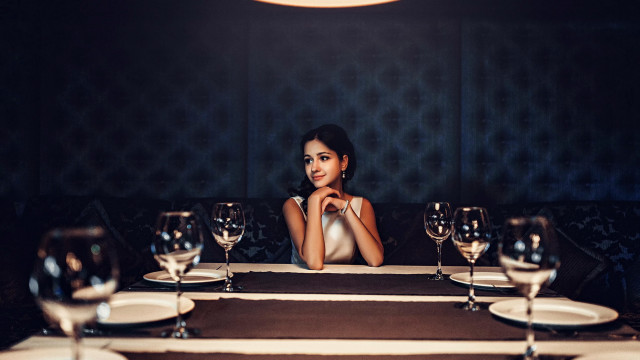 Woman sitting wine glasses portrait free wallpaper for desktop - medium preview image
