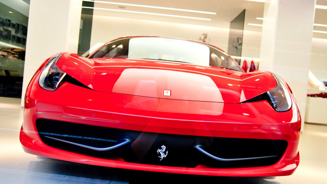 Red sports car showroom white free wallpaper for desktop - medium preview image