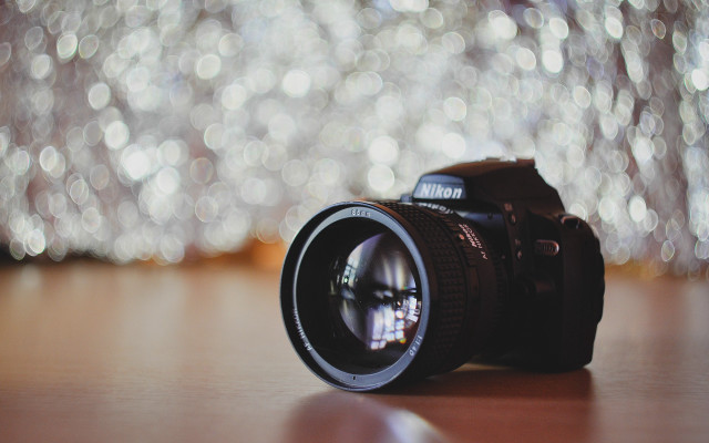 Camera lens table blurry lights free wallpaper for desktop - medium preview image