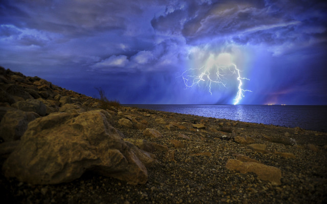 Lightning bolt ocean rocks cloudy free wallpaper for desktop - medium preview image